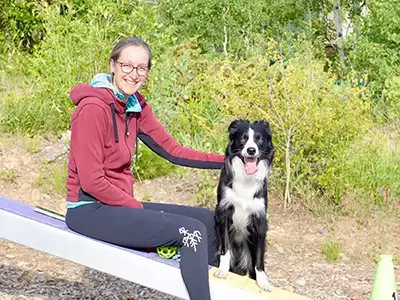 Cosmic Dog Training, Kathleen and Fabi at an agility center, Nederland Colorado.